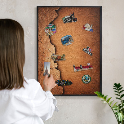 Metal wall board for magnets in a black frame Wooden texture