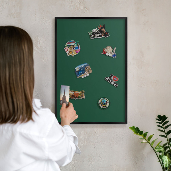 Metal wall board for magnets in a black frame Bottle green