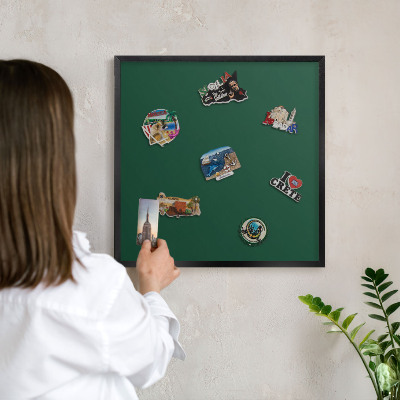 Metal wall board for magnets in a black frame Bottle green
