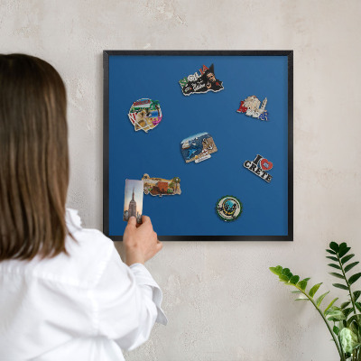 Metal wall board for magnets in a black frame Dark blue