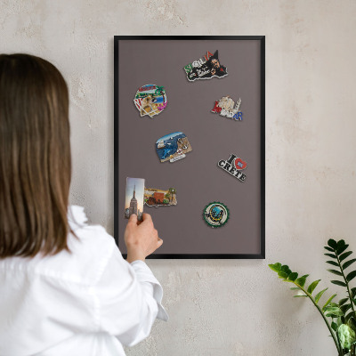 Metal wall board for magnets in a black frame Faded brown
