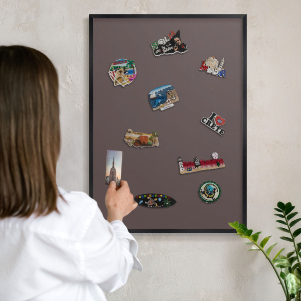 Metal wall board for magnets in a black frame Faded brown