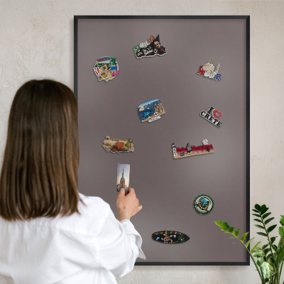 Metal wall board for magnets in a black frame Faded brown