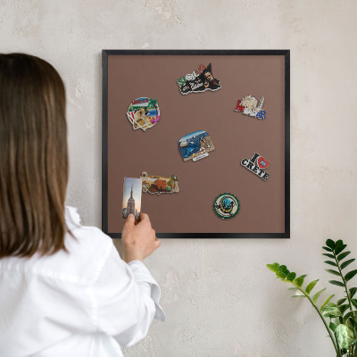Metal wall board for magnets in a black frame Brown color