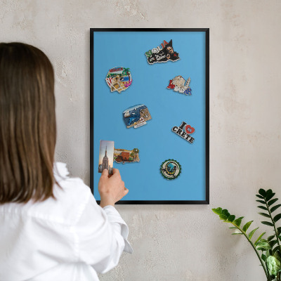 Vacation magnet board with a black frame Blue water