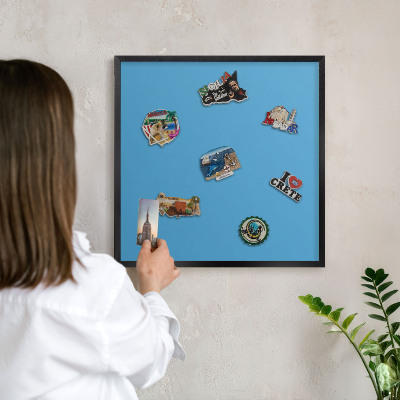 Vacation magnet board with a black frame Blue water