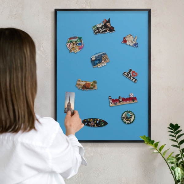Vacation magnet board with a black frame Blue water
