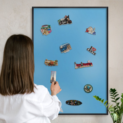 Vacation magnet board with a black frame Blue water