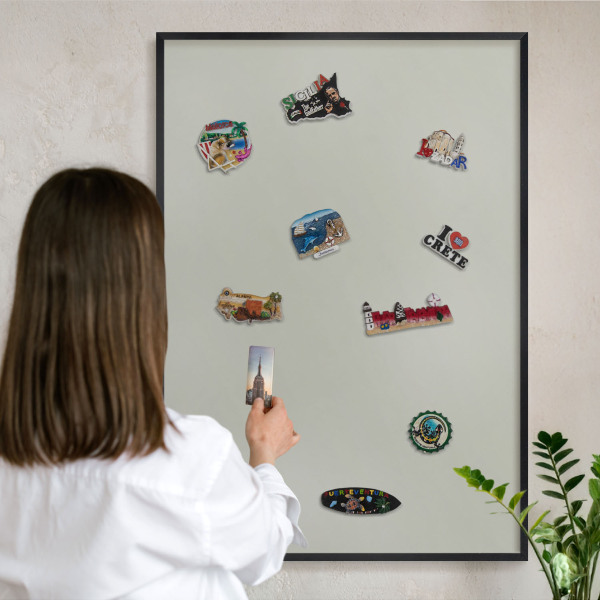 Metal wall board for magnets in a black frame Warm gray