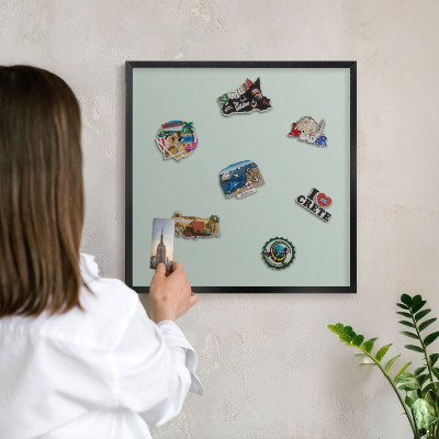 Vacation magnet board with a black frame Light mint