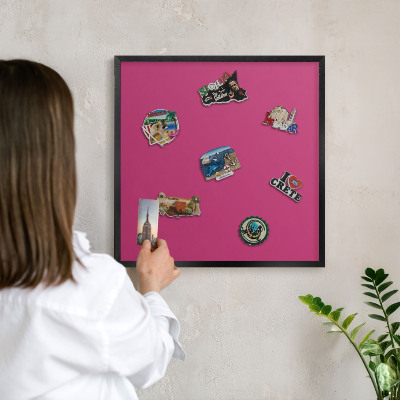 Metal wall board for magnets in a black frame Intense pink