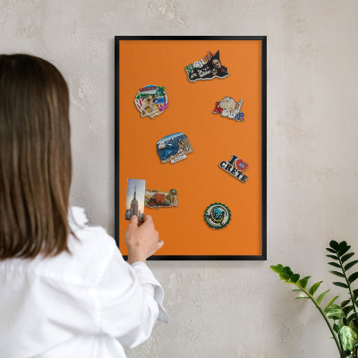 Vacation magnet board with a black frame Strong orange