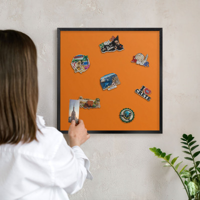 Vacation magnet board with a black frame Strong orange