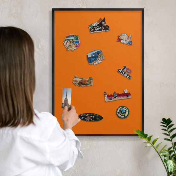 Vacation magnet board with a black frame Strong orange