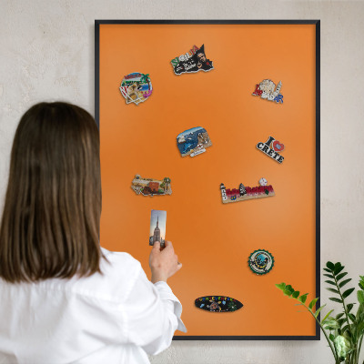 Vacation magnet board with a black frame Strong orange