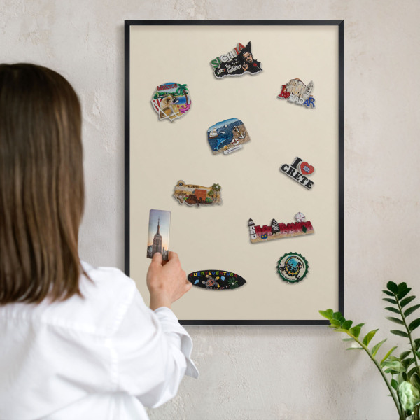 Metal wall board for magnets in a black frame Light stone