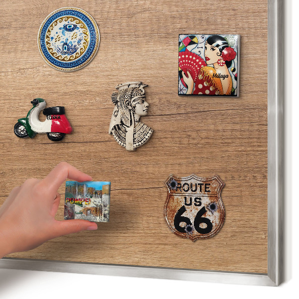 Souvenir magnet display board with a silver frame Wood texture