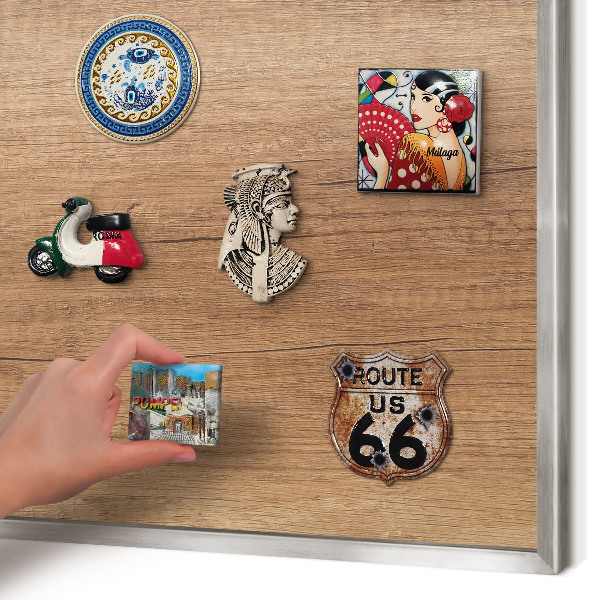 Souvenir magnet display board with a silver frame Wood texture