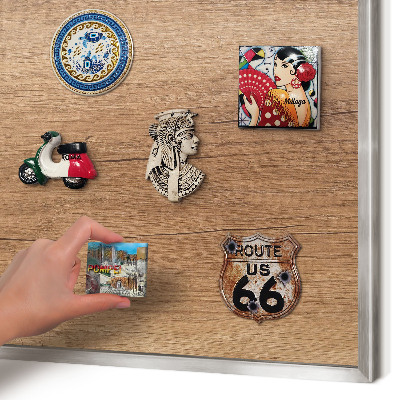 Souvenir magnet display board with a silver frame Wood texture