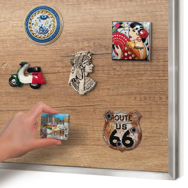 Souvenir magnet display board with a silver frame Wood texture