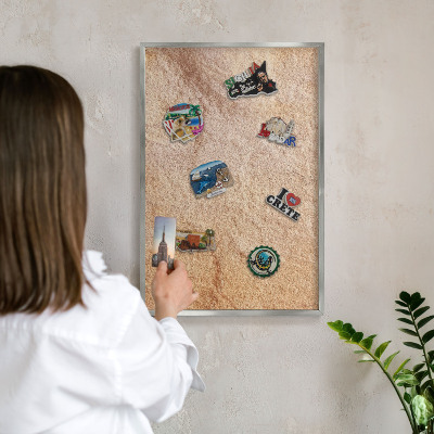 Souvenir magnet display board with a silver frame Stone texture