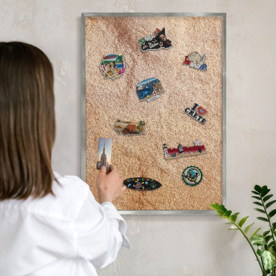 Souvenir magnet display board with a silver frame Stone texture