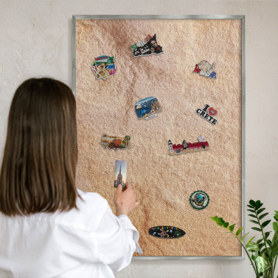 Souvenir magnet display board with a silver frame Stone texture