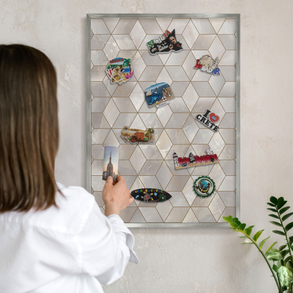 Souvenir magnet display board with a silver frame Cubic background
