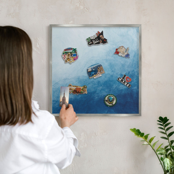 Souvenir magnet display board with a silver frame Blue abstractions