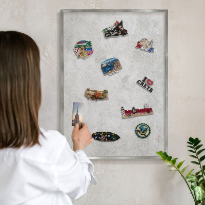 Souvenir magnet display board with a silver frame Gray elegance