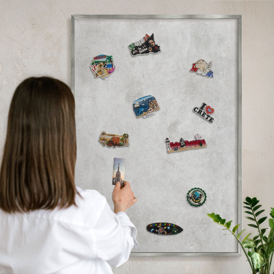 Souvenir magnet display board with a silver frame Gray elegance