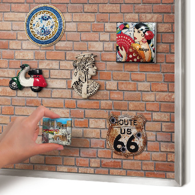 Souvenir magnet display board with a silver frame Brick wall