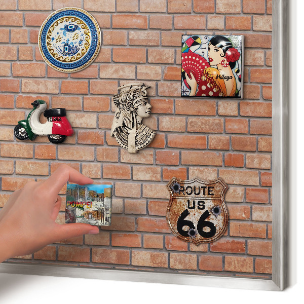 Souvenir magnet display board with a silver frame Brick wall