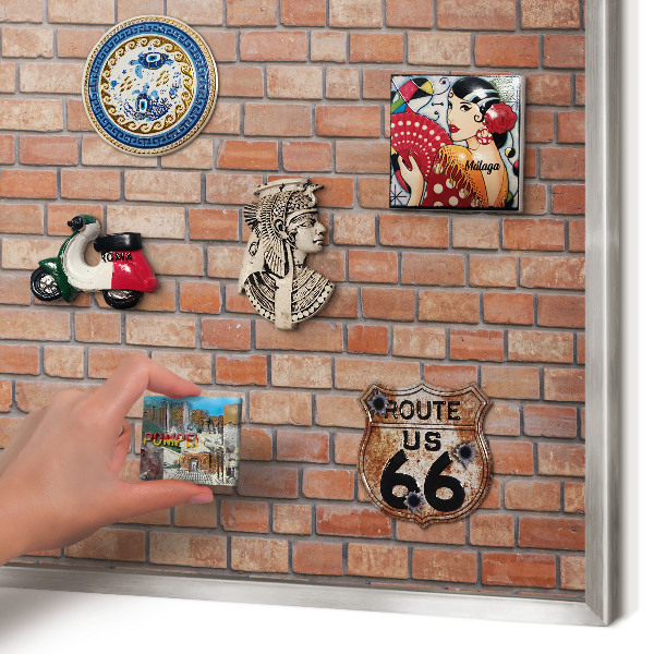 Souvenir magnet display board with a silver frame Brick wall