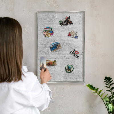 Souvenir magnet display board with a silver frame Gray texture