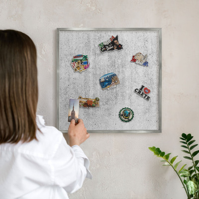 Souvenir magnet display board with a silver frame Gray texture