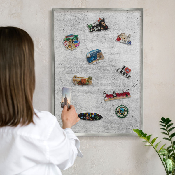 Souvenir magnet display board with a silver frame Gray texture