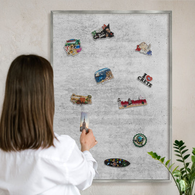 Souvenir magnet display board with a silver frame Gray texture