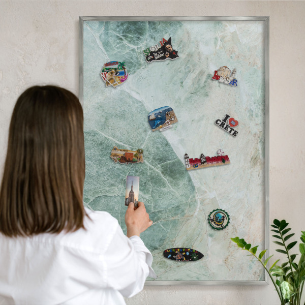 Souvenir magnet display board with a silver frame Green textures