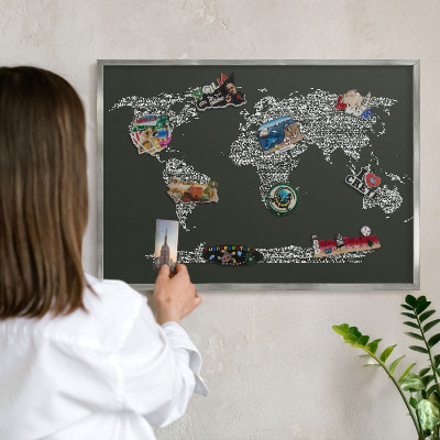 Souvenir magnet display board with a silver frame Text map