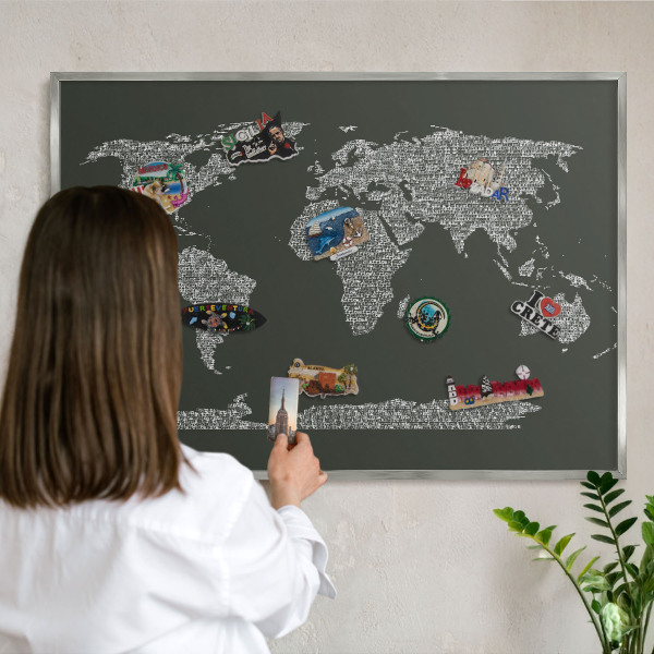 Souvenir magnet display board with a silver frame Text map