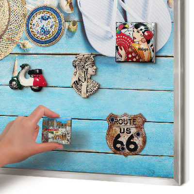 Souvenir magnet display board with a silver frame Holiday atmosphere