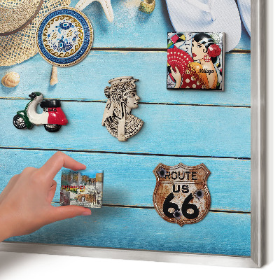 Souvenir magnet display board with a silver frame Holiday atmosphere