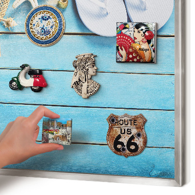 Souvenir magnet display board with a silver frame Holiday atmosphere