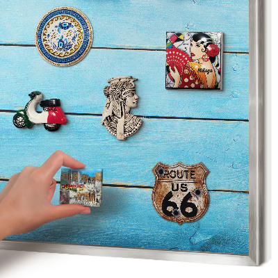Souvenir magnet display board with a silver frame Holiday atmosphere