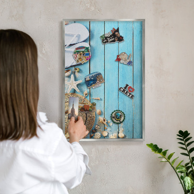 Souvenir magnet display board with a silver frame Holiday atmosphere