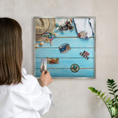 Souvenir magnet display board with a silver frame Holiday atmosphere