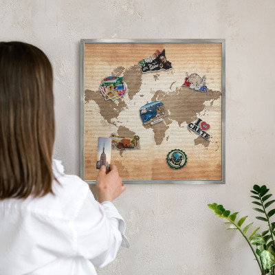 Souvenir magnet display board with a silver frame World map