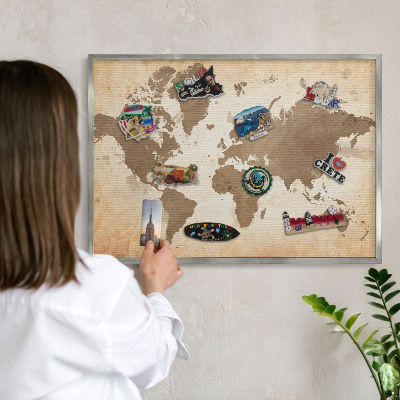 Souvenir magnet display board with a silver frame World map