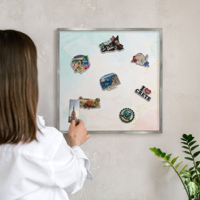 Souvenir magnet display board with a silver frame Pastel elegance